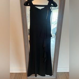 Aqua formal size 4 black cascading gown from Bloomingdale’s. New with tags.